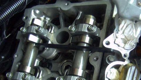 1997 Ford Taurus - Close-up view of an engine's valve train components, including camshafts and lifters.