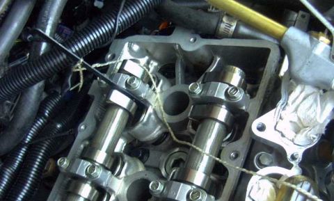 1997 Ford Taurus - Engine valve train components, likely during maintenance or repair. No specific vehicle year identified.