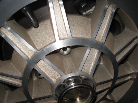 1968 Shelby GT500 - Detail of a 1968 Shelby GT500 wheel, the iconic Cobra emblem and a distinctive spoke design.