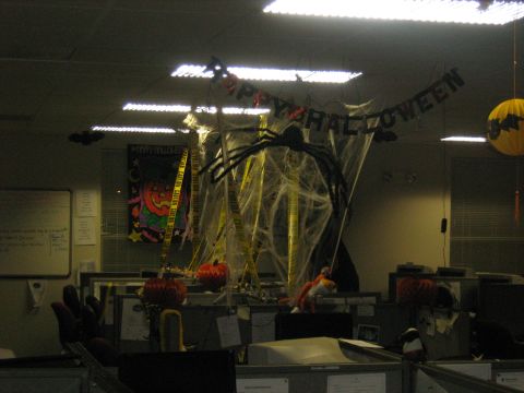 1988 Mercury Grand Marquis - Office cubicles are decorated for Halloween with spooky cobwebs, a giant spider, and pumpkins.