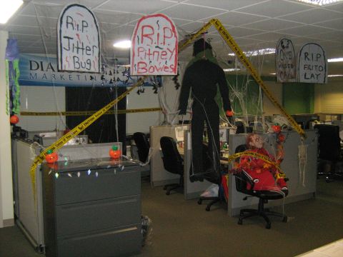 1988 Mercury Grand Marquis - Office cubicles are transformed into a Halloween scene with spooky decorations and caution tape.