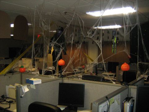 1988 Mercury Grand Marquis - Office cubicles are decorated with fake spiderwebs and Halloween props for a festive atmosphere.