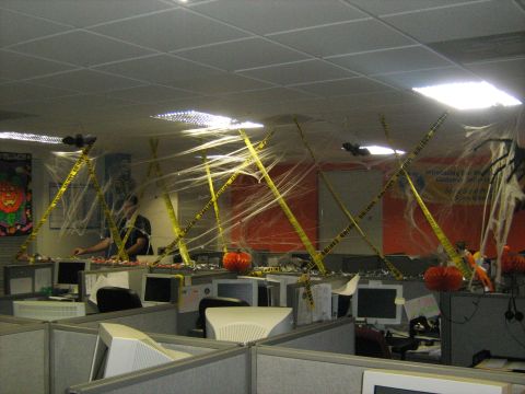 1988 Mercury Grand Marquis - Cubicle farm transformed into a spooky Halloween scene with cobwebs and caution tape.
