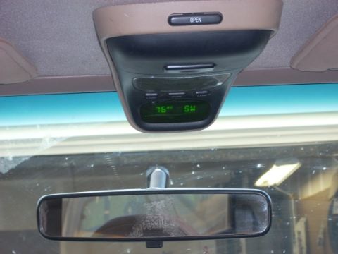 1992 Ford Bronco - The overhead console displays the temperature as 76 degrees and the compass direction as SW.