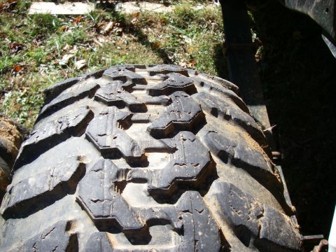 1978 Ford Bronco - Close-up of an off-road tire tread, showing wear and tear.