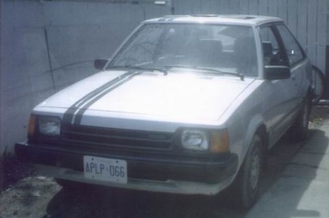 1985 Mazda GLC - This 1985 Mazda GLC is shown from the front, dual racing stripes and a visible license plate.