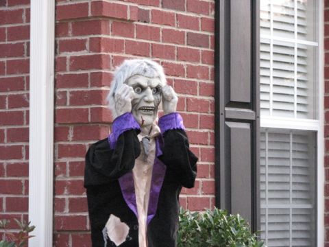 1991 Ford Bronco - A spooky Halloween decoration is placed outside a home, adding a festive and frightening touch to the decor.