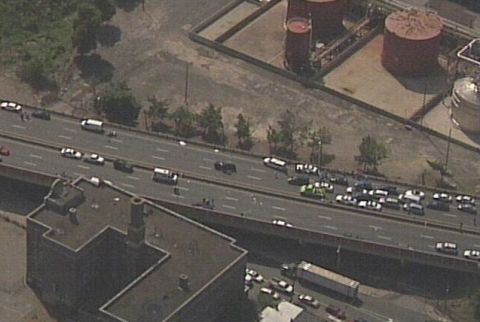 1993 Ford Bronco - An aerial view captures a significant traffic jam on a highway, with numerous vehicles stalled in lanes.