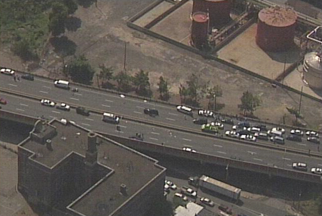 Aerial view of a highway traffic jam with multiple cars and trucks