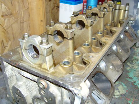 2007 Ford Mustang - A disassembled engine cylinder head with visible valve train components and bolts, suggesting a repair or maintenance process.