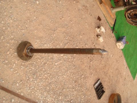 1992 Ford Bronco - Axle shaft with bearing, likely removed from a vehicle for repair or replacement.