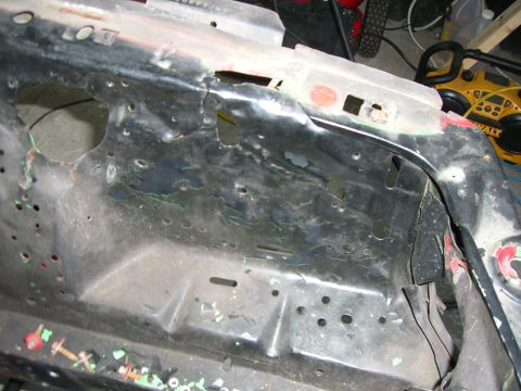 1988 Ford Bronco - This image shows the corroded and damaged metal frame of a vehicle, not a complete car.