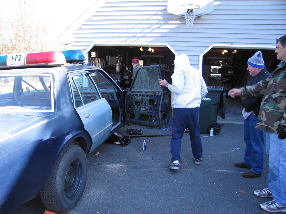 Police car side view, doors removed, with 'FP2' on light bar