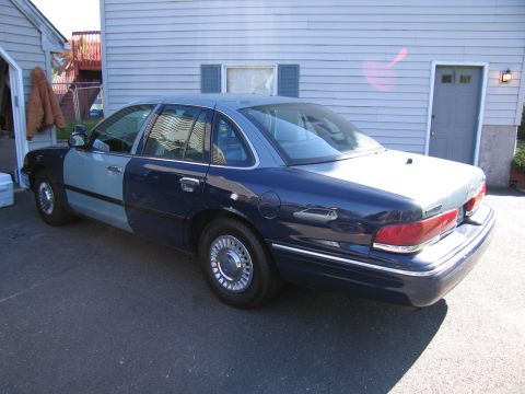 2001 Ford Crown Victoria - This 2001 Ford Crown Victoria has a two-tone paint job with a lighter blue on the front half and a darker blue on the rear half.