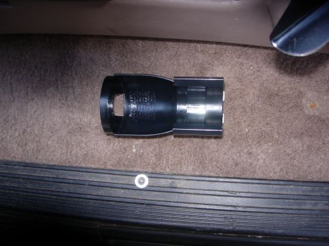 1993 Ford Bronco - Interior car part shown on the carpeted floor of a vehicle.
