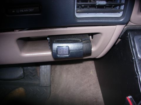 1993 Ford Bronco - A digital gauge is visible inside the vehicle's dashboard, near the air vents and rear defroster control.