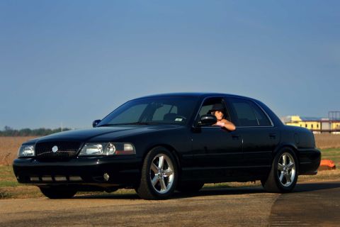 2003 Mercury Marauder - Black 2003 Mercury Marauder sedan with custom wheels and tinted windows.