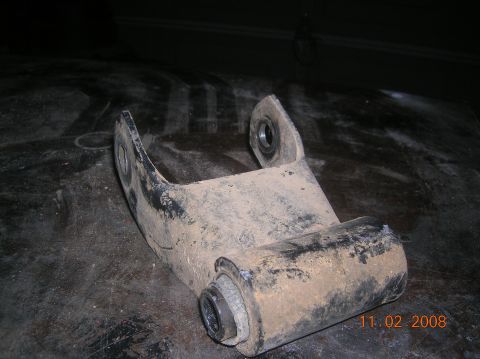 1985 Ford Bronco - A close-up of a used suspension component, likely from a vehicle's drivetrain.