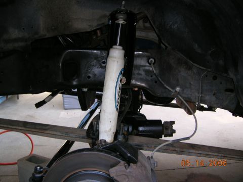 1985 Ford Bronco - Close-up of a vehicle's front suspension system, showing a shock absorber and brake components. The date 05.14.2006 is visible.