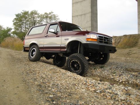1996 Ford Bronco - This 1996 Ford Bronco is shown off-road with a custom bumper and lifted suspension.