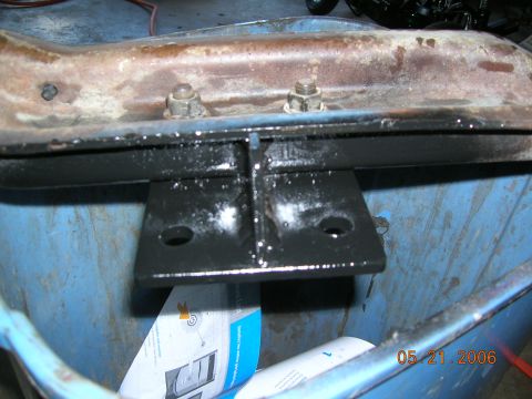 1985 Ford Bronco - Modified suspension part, possibly for a solid axle swap, shown in a blue bin.
