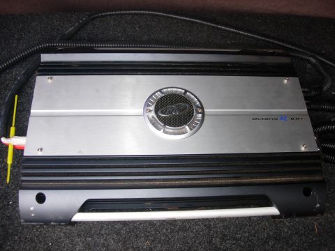 1993 Ford Bronco - A car amplifier is shown with visible wiring and a textured surface.