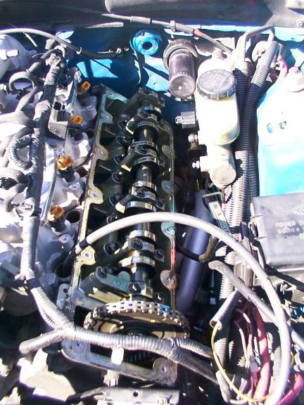 2007 Ford Mustang - Close-up view of an engine's internal components, including the camshaft and timing chain mechanism.