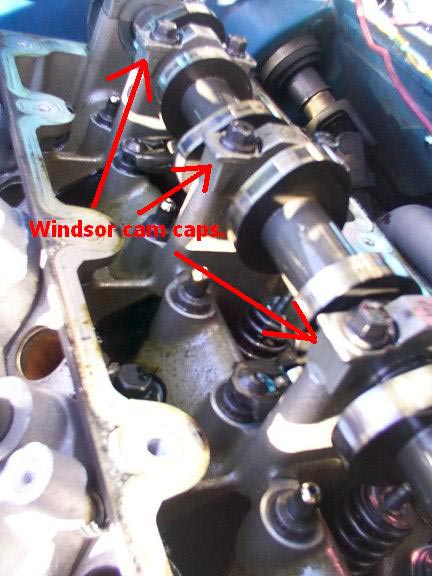 2007 Ford Mustang - Close-up of an engine's camshaft and valve train components, with text indicating 'Windsor cam caps'.