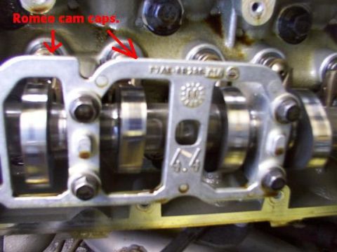 2007 Ford Mustang - This image shows a close-up view of engine components, specifically highlighting the Romeo cam caps with red arrows and text.