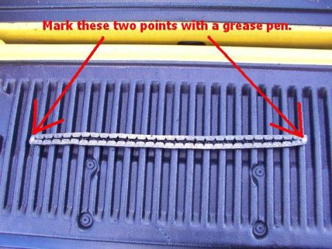 2007 Ford Mustang - Timing chain marked for reference on a truck bed, with instructions to use a grease pen.
