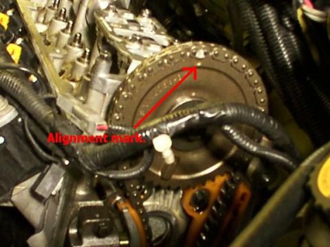 2007 Ford Mustang - Close-up view of an engine's internal timing mechanism, highlighting an alignment mark.