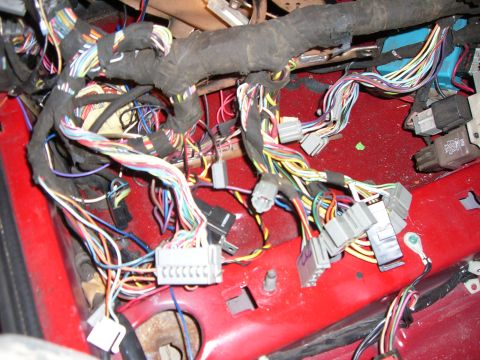 1988 Ford Bronco - A complex vehicle wiring harness is visible, numerous colorful wires and grey electrical connectors.