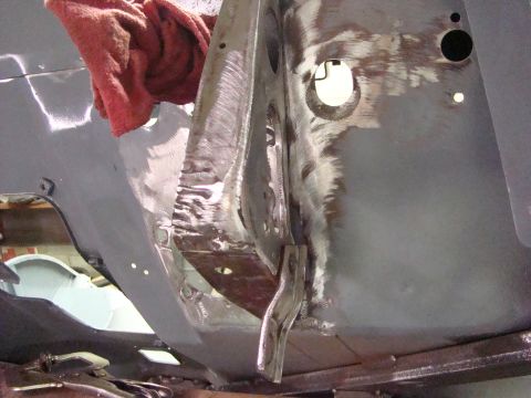 1948 Jeep Wrangler - Close-up view of a vehicle's bare metal bodywork, revealing repair marks and structural components.