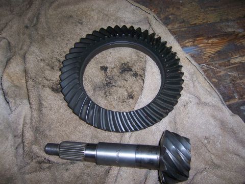 1991 Ford Bronco - Differential ring gear and pinion shaft shown on a cloth. Part number B9540 is visible on the shaft.