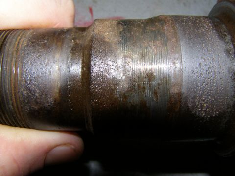 1993 Ford Bronco - This rusted metal shaft shows significant wear and corrosion.