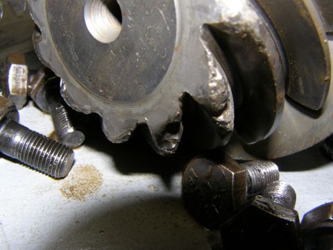 1993 Ford Bronco - Close-up of damaged gears and bolts, likely from a mechanical assembly.