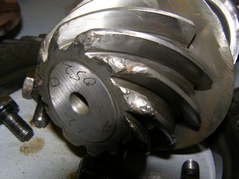 1993 Ford Bronco - This differential gear shows significant damage to its teeth and casing, indicating a failure.