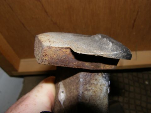 1993 Ford Bronco - A close-up view of a rusty metal component, with a watermark indicating the source as Supermotors.net.