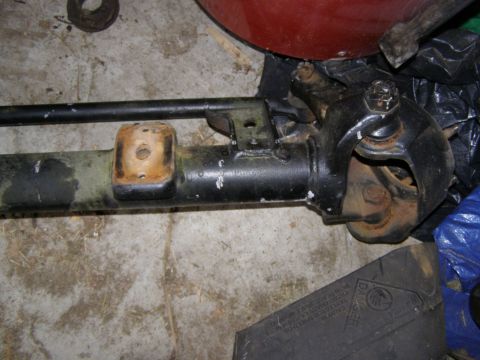 1993 Ford Bronco - Close-up of a vehicle axle component, showing wear and tear on the metal parts.