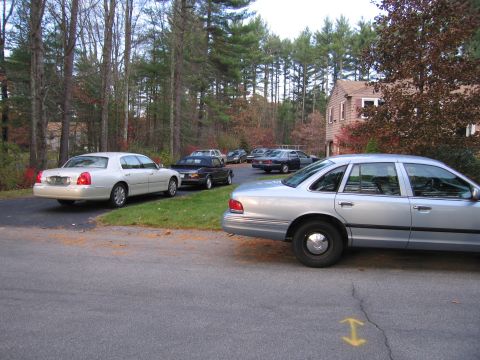 1991 Ford LTD Crown Victoria - A silver 1991 Ford Crown Victoria LTD is parked in a driveway with other vehicles.