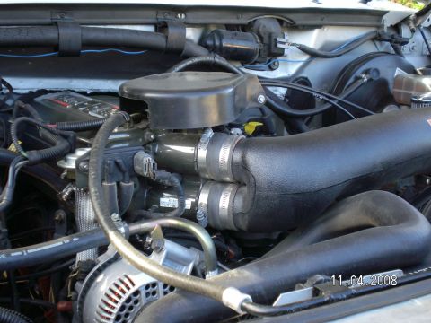 1996 Ford Bronco - One end seals around each throttle body tube with silicone hoses.
