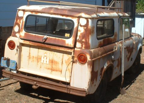 1961 International Scout 800 - This heavily weathered 1961 International Scout 800 shows significant rust but retains its distinctive body style and roof rack.