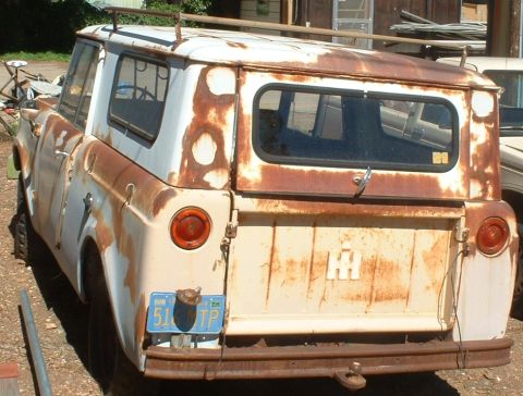 1961 International Scout 800 - This vintage International Scout shows significant rust and wear, but its iconic design is still recognizable.