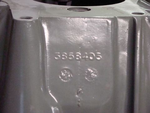 1948 Jeep Wrangler - Close-up of a gray engine component showing the stamped identification number 3853405.
