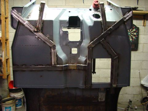 1948 Jeep Wrangler - Vehicle chassis frame undergoing repair work with added metal bracing.