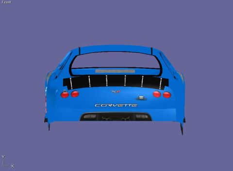 2004 Jeep Wrangler - Rear view of a blue Corvette, a prominent spoiler and distinctive taillights.