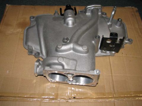 2003 Mercury Marauder - Engine intake manifold shown on a cardboard surface.