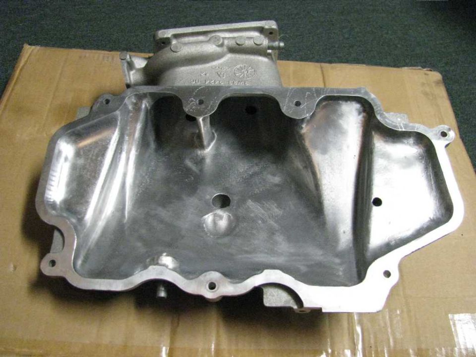 Aluminum intake manifold with "SUPERMOTORS" logo visible at bottom right