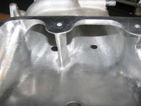 2003 Mercury Marauder - This is a close-up view of an engine's intake manifold, showing its internal structure and ports.