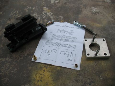 1997 Ford Crown Victoria - Master cylinder kit components laid out with installation guide on a concrete surface.